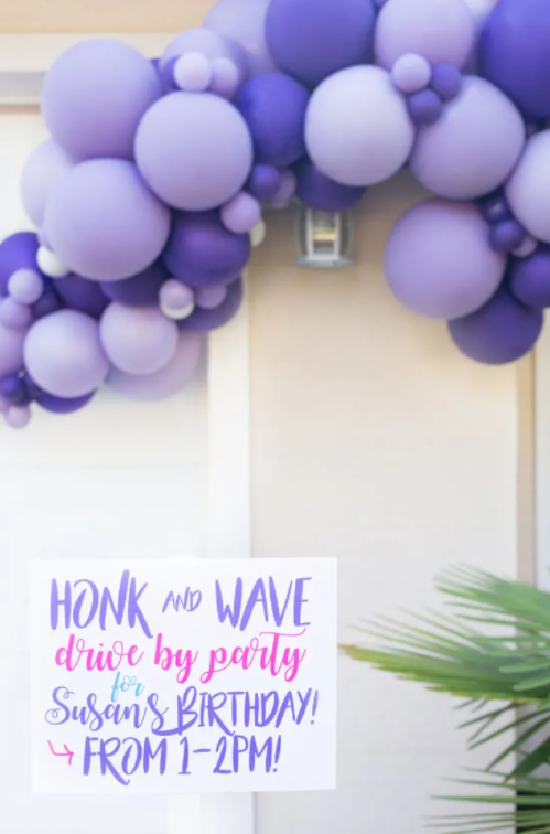 Purple yard sign for birthday parade with purple balloons
