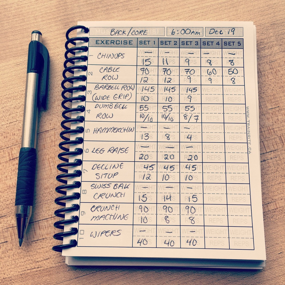 Exercise journal written by hand with a pen