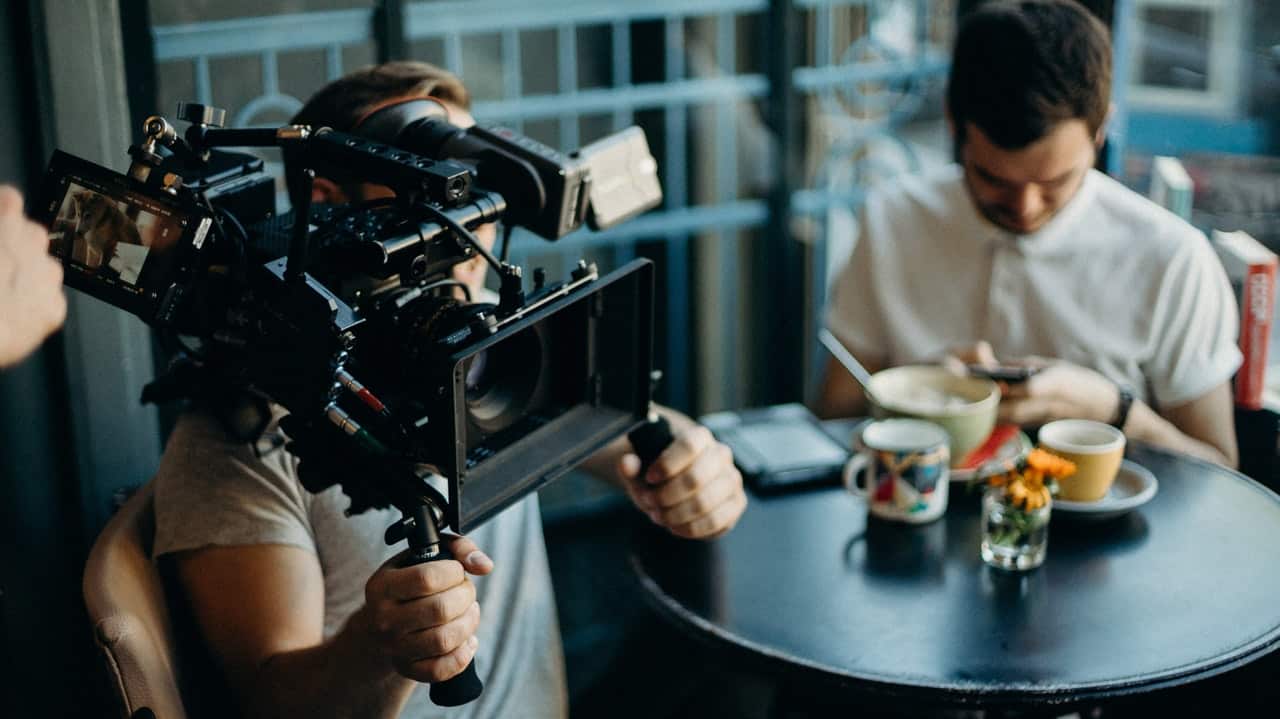 Man holding camera in film shoot