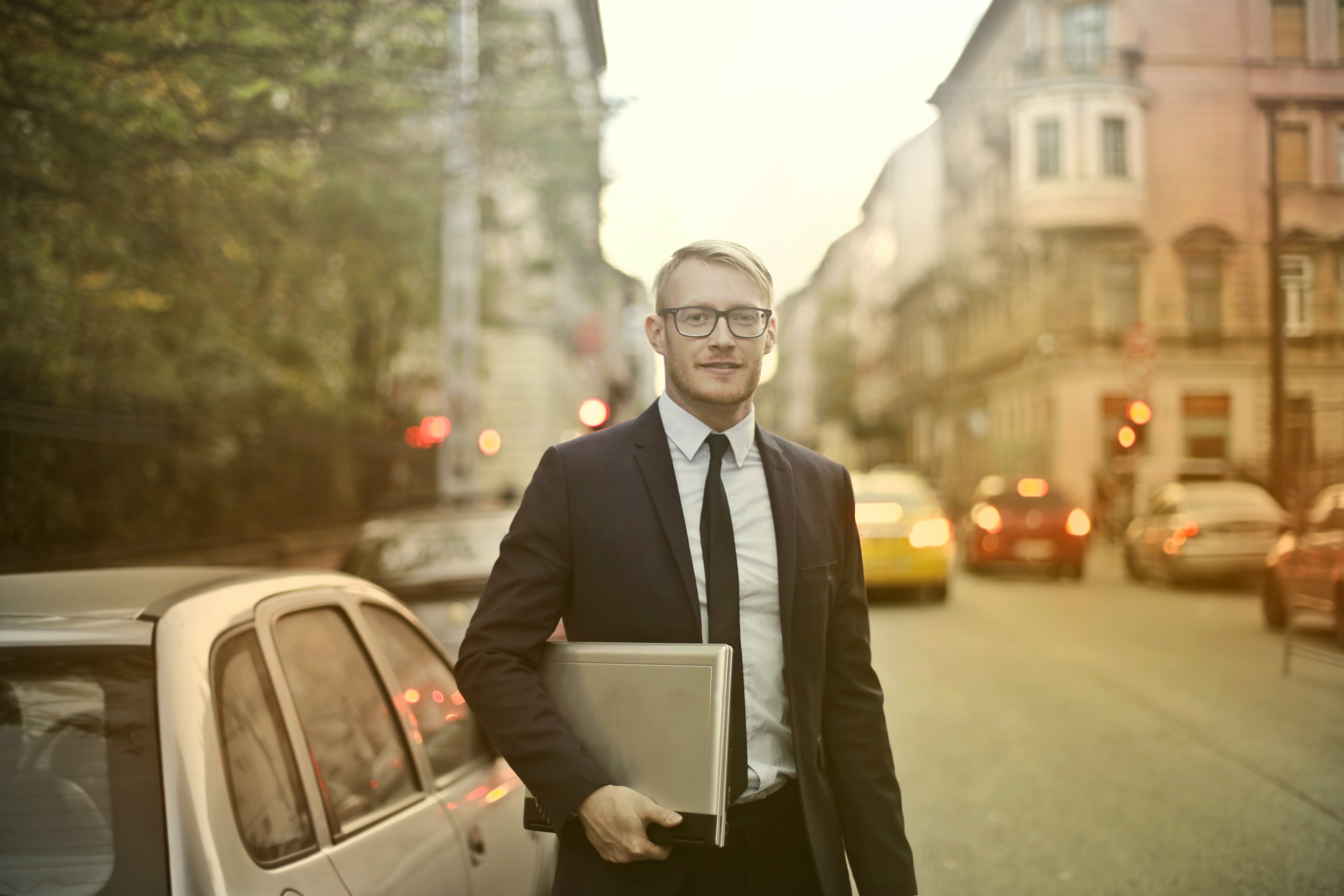 Car Salesman On The Street With A Portfolio 