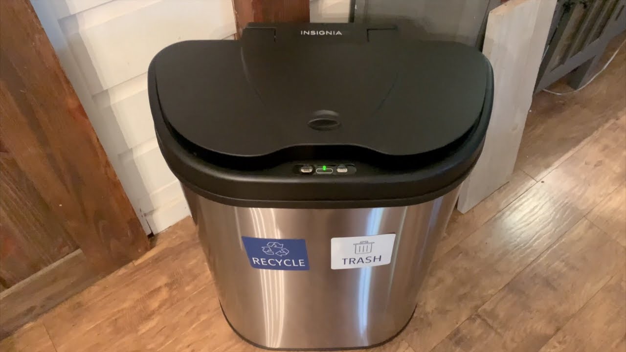 A recycled new model of a touchless trash can in the room with Recycle and Trash labels