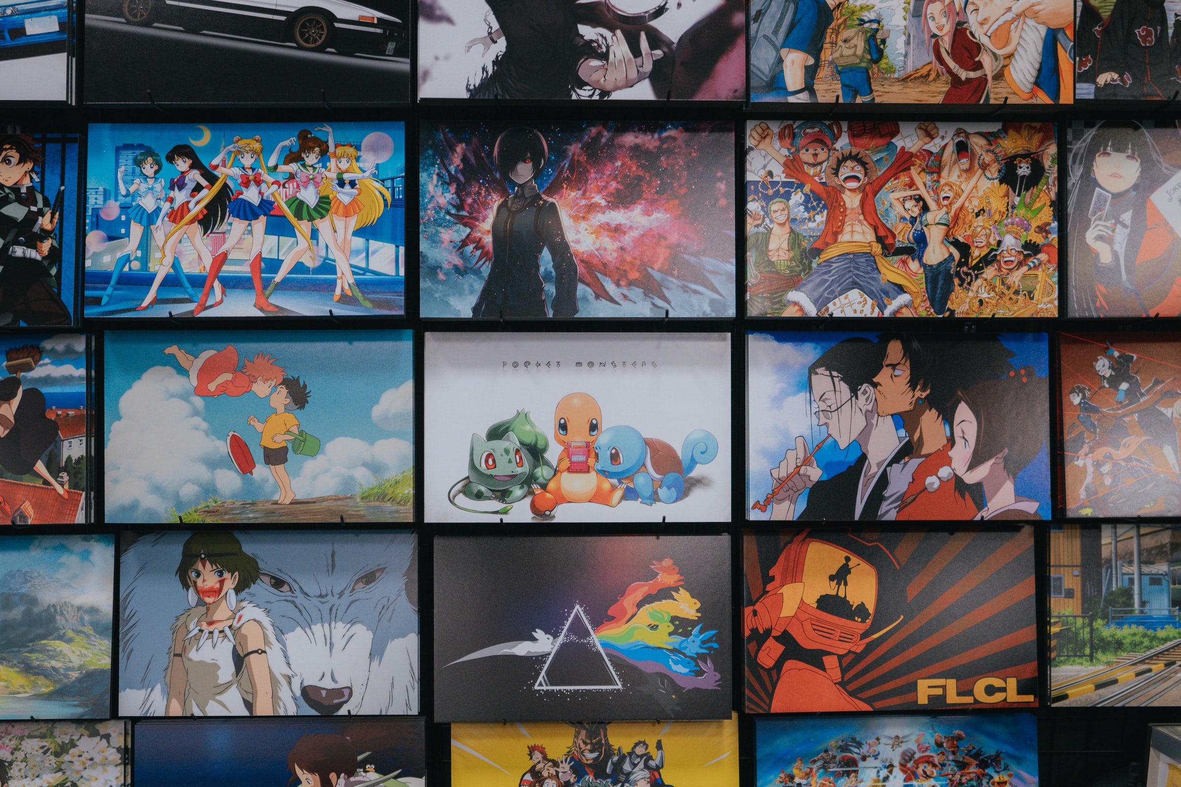 Diffrent anime and anime movie pictures on a wall
