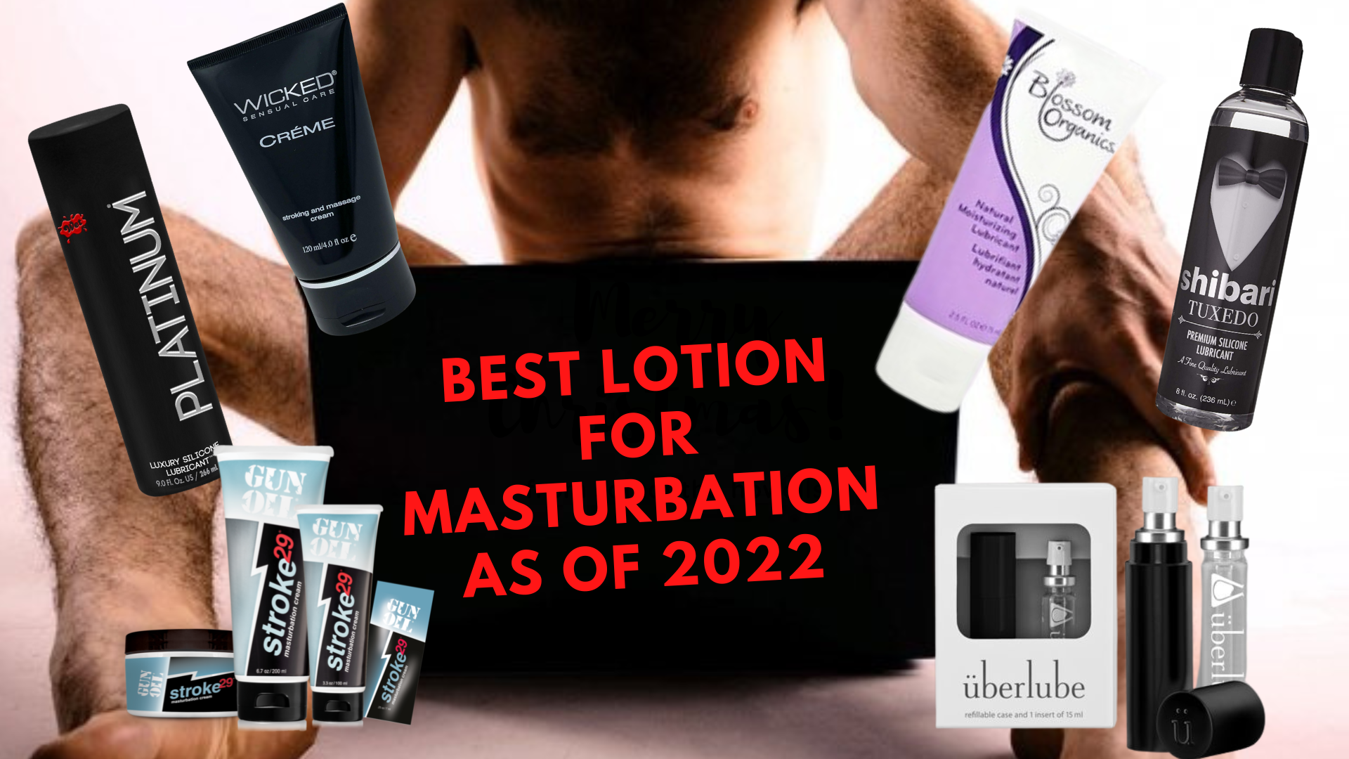 A naked man sitting in front of a laptop with masturbation lotions around him