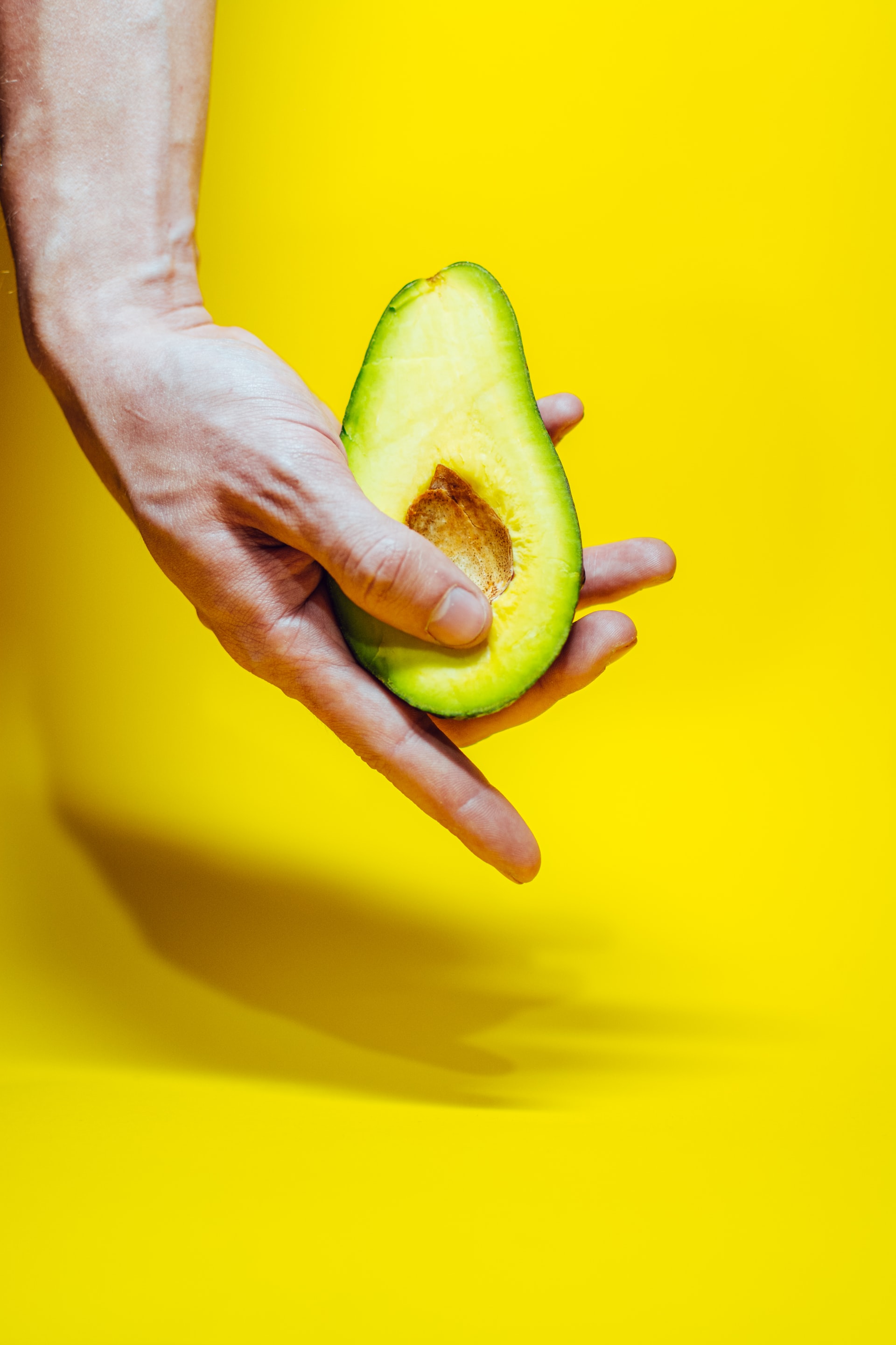 Hands holding an avocado representing sexuality